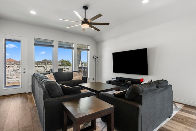 living area featuring a ceiling fan, recessed lighting, wood finished floors, and a healthy amount of sunlight