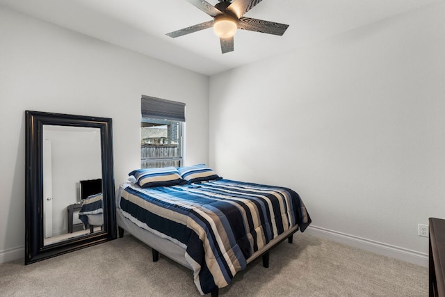 bedroom featuring a ceiling fan, carpet, and baseboards