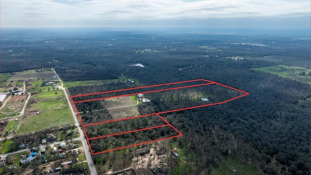 birds eye view of property with a rural view