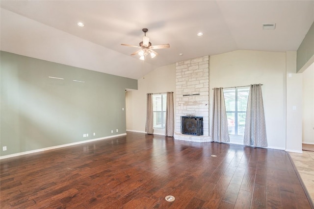 unfurnished living room with a ceiling fan, vaulted ceiling, visible vents, wood finished floors, and baseboards