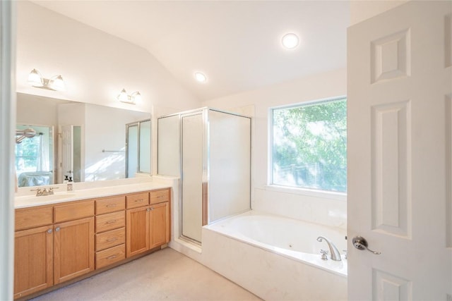 ensuite bathroom featuring ensuite bathroom, a shower stall, vanity, vaulted ceiling, and a whirlpool tub