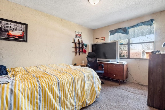 bedroom with carpet flooring, a textured ceiling, and a textured wall