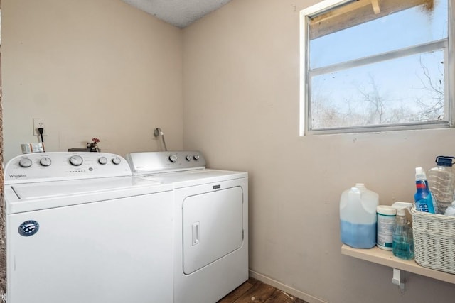 laundry room featuring washer and clothes dryer, laundry area, baseboards, and wood finished floors