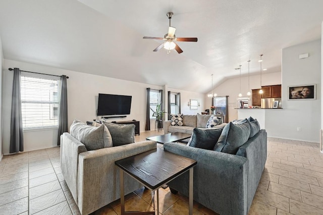 living room featuring light tile patterned flooring, baseboards, ceiling fan, and vaulted ceiling