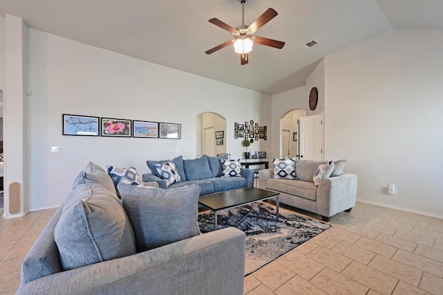 living room featuring vaulted ceiling, a ceiling fan, light tile patterned floors, arched walkways, and visible vents