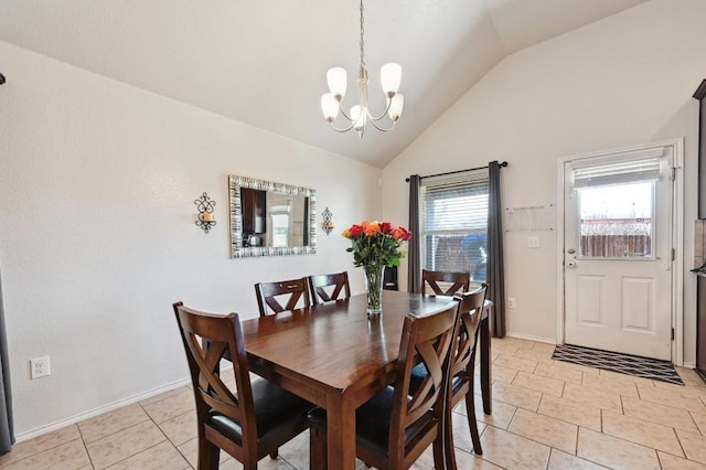 dining room featuring light tile patterned floors, a notable chandelier, baseboards, and vaulted ceiling