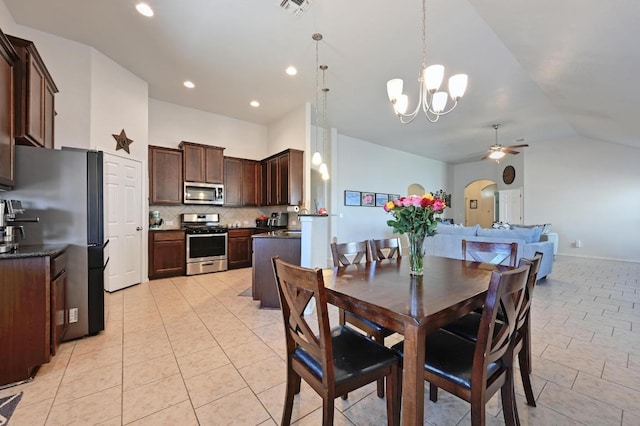 dining space with recessed lighting, vaulted ceiling, visible vents, arched walkways, and ceiling fan with notable chandelier