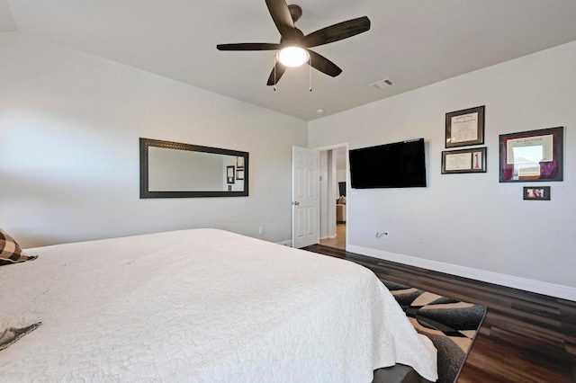 bedroom with visible vents, ceiling fan, dark wood-type flooring, and baseboards