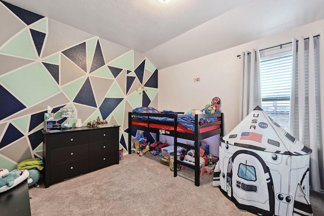 carpeted bedroom featuring a textured ceiling and vaulted ceiling