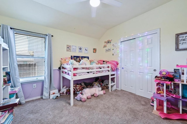 carpeted bedroom with lofted ceiling, a ceiling fan, and a closet