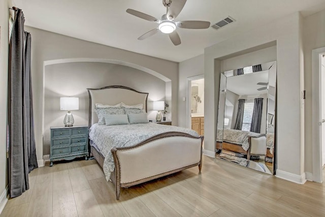 bedroom featuring light wood-style flooring, baseboards, and visible vents