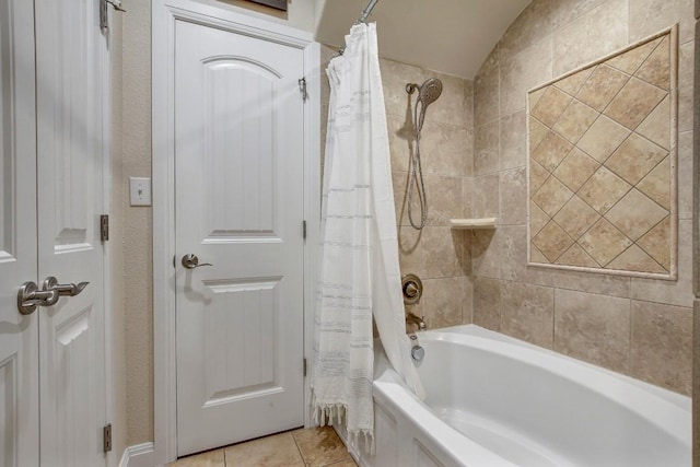 full bath with tile patterned floors and shower / bath combo with shower curtain