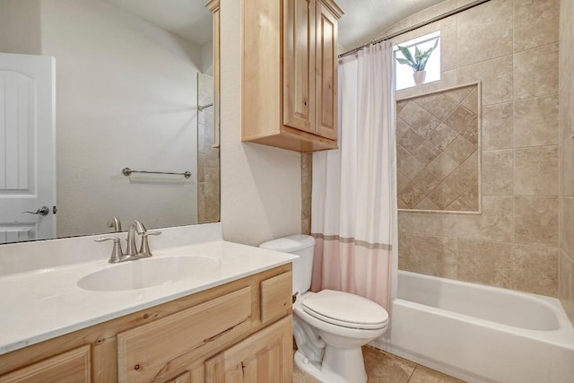 bathroom featuring tile patterned floors, toilet, shower / bath combo, and vanity