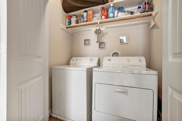 laundry area with separate washer and dryer and laundry area