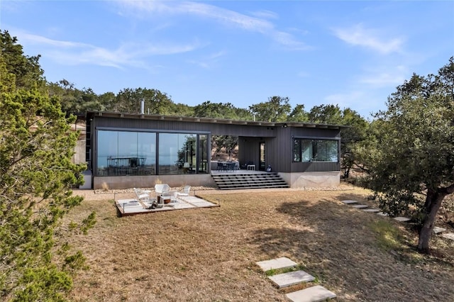 rear view of house featuring a patio area