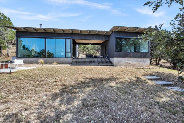 back of house with a sunroom