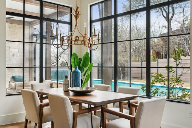 dining room with an inviting chandelier and wood finished floors