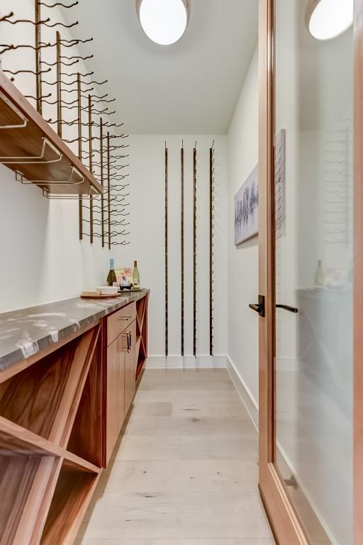 interior space featuring baseboards and light wood-style flooring