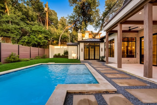 view of swimming pool with a patio area, a fenced in pool, a lawn, and a fenced backyard