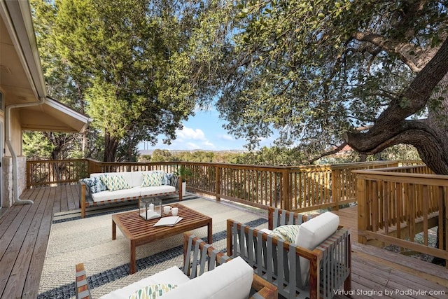 wooden deck with an outdoor living space