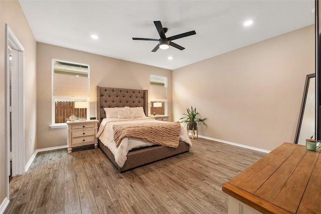 bedroom featuring recessed lighting, baseboards, and wood finished floors