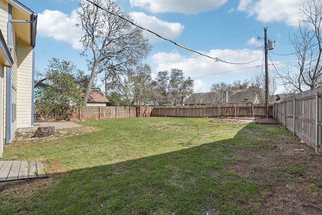 view of yard featuring a patio area and a fenced backyard