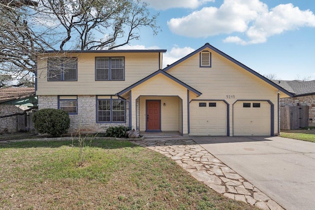 view of front of house featuring fence, an attached garage, a front lawn, concrete driveway, and stone siding