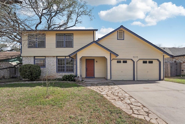 5217 Summerset Trl, Austin, TX 78749 - view of front of house with a garage, concrete driveway, and stone siding