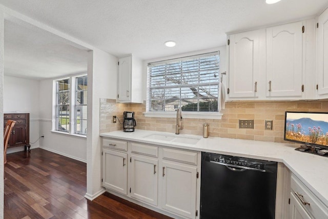 5217 Summerset Trl, Austin, TX 78749 - kitchen featuring dishwasher, white cabinets, decorative backsplash, a textured ceiling, and recessed lighting