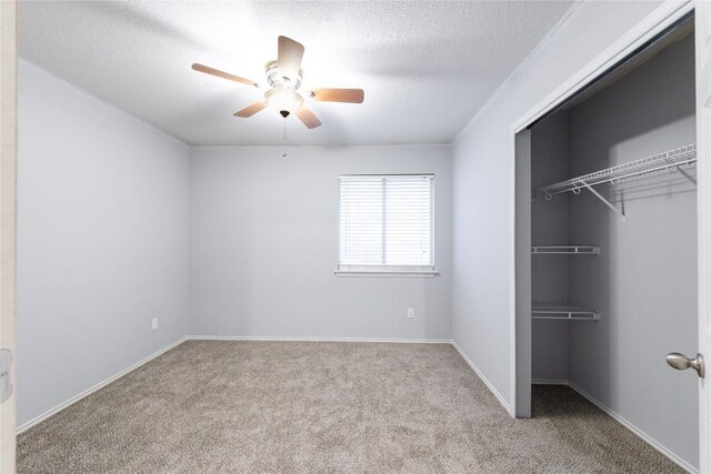 3524 Rock Shelf Ln, Round Rock, TX 78681 - unfurnished bedroom with carpet, a closet, a textured ceiling, a ceiling fan, and baseboards