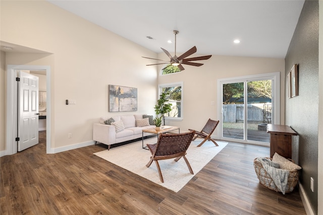 living room with wood finished floors, a healthy amount of sunlight, visible vents, and baseboards