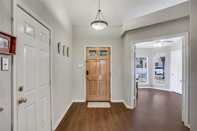 entrance foyer featuring dark wood finished floors and baseboards