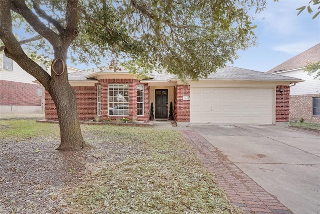 ranch-style house with an attached garage, brick siding, and driveway