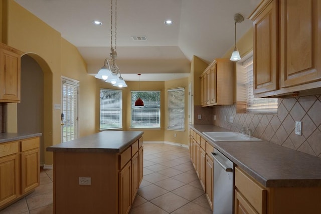 kitchen with visible vents, a sink, a kitchen island, dishwasher, and vaulted ceiling