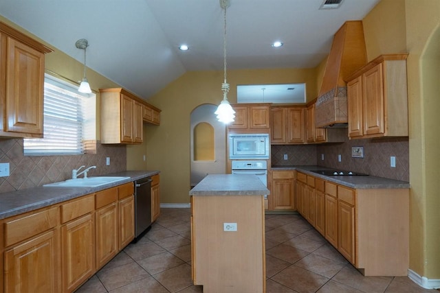 kitchen featuring lofted ceiling, light tile patterned flooring, arched walkways, white appliances, and a sink