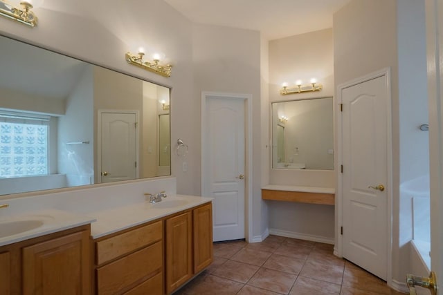 full bath with tile patterned flooring, double vanity, and a sink