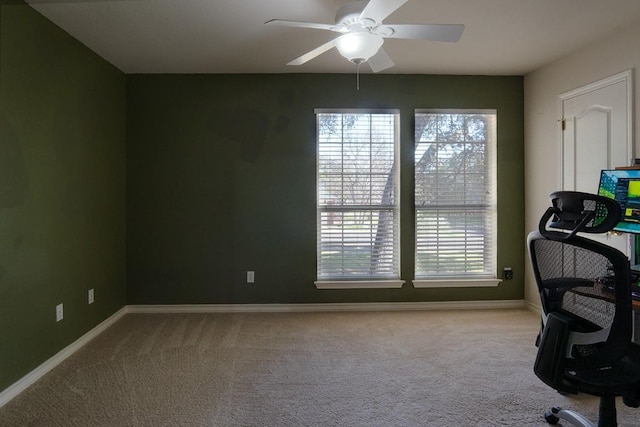 office area featuring a wealth of natural light, baseboards, and carpet floors