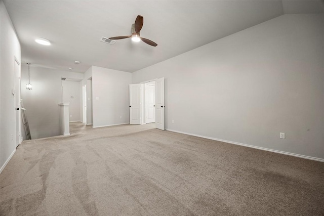 unfurnished bedroom with vaulted ceiling, carpet flooring, baseboards, and visible vents