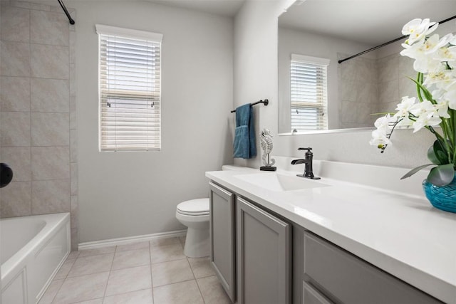 full bath featuring baseboards, toilet, shower / bath combination, tile patterned floors, and vanity