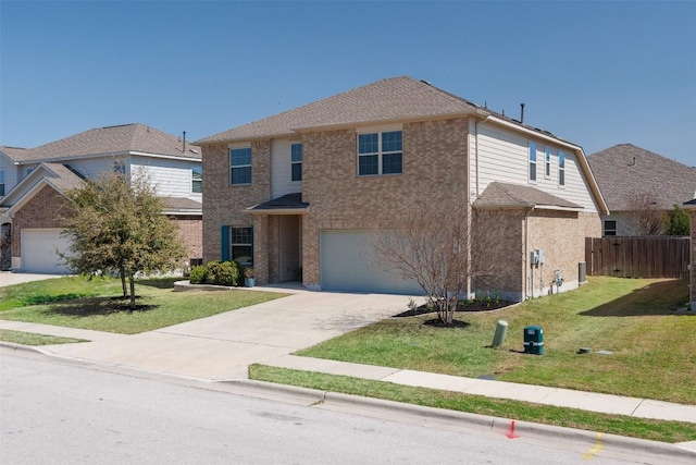 traditional home with driveway, fence, an attached garage, a front yard, and brick siding