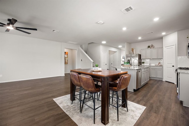 dining room with recessed lighting, dark wood-style floors, and visible vents