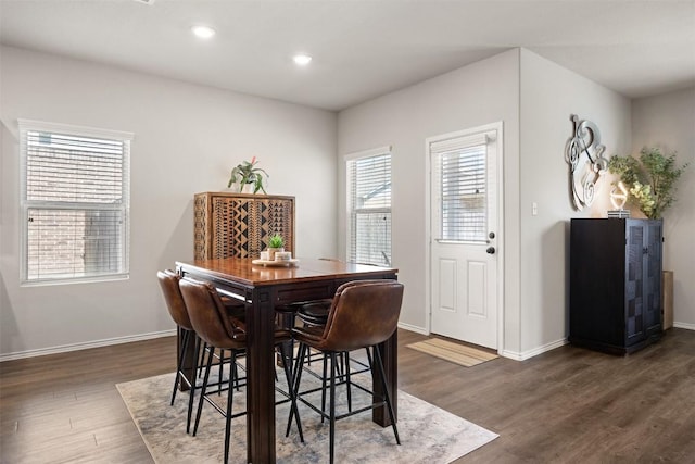 dining space featuring recessed lighting, baseboards, and dark wood-style flooring