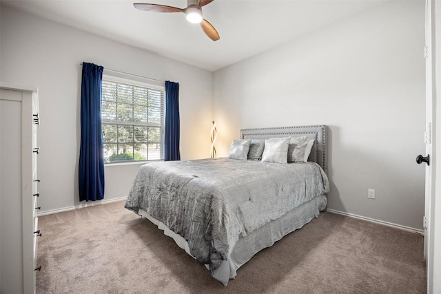 bedroom with baseboards, carpet floors, and ceiling fan