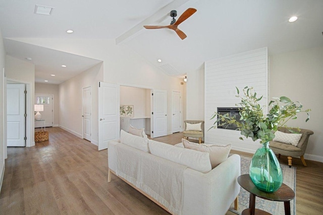 103 Manana Ct, Bastrop, TX 78602 - living room with a ceiling fan, wood finished floors, a fireplace, and recessed lighting
