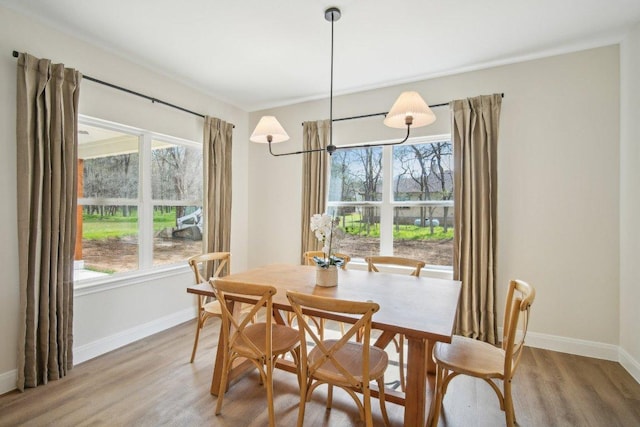 103 Manana Ct, Bastrop, TX 78602 - dining area featuring baseboards and light wood finished floors
