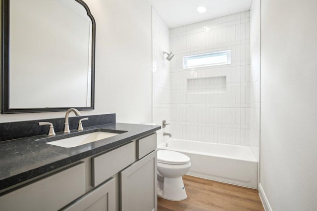 103 Manana Ct, Bastrop, TX 78602 - bathroom with vanity, shower / bathtub combination, and wood finished floors
