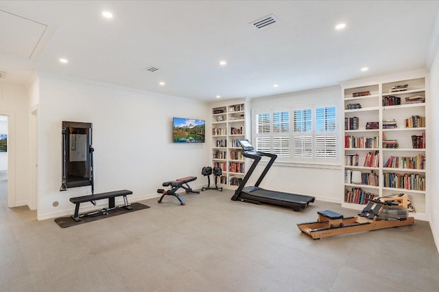 workout area with built in shelves, recessed lighting, crown molding, baseboards, and attic access