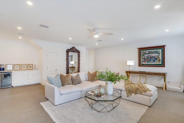 living area with visible vents, beverage cooler, a ceiling fan, recessed lighting, and crown molding