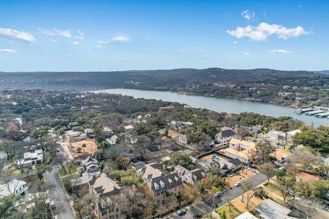 birds eye view of property with a water view and a residential view