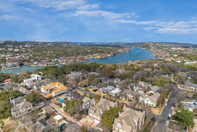 drone / aerial view with a water view and a residential view